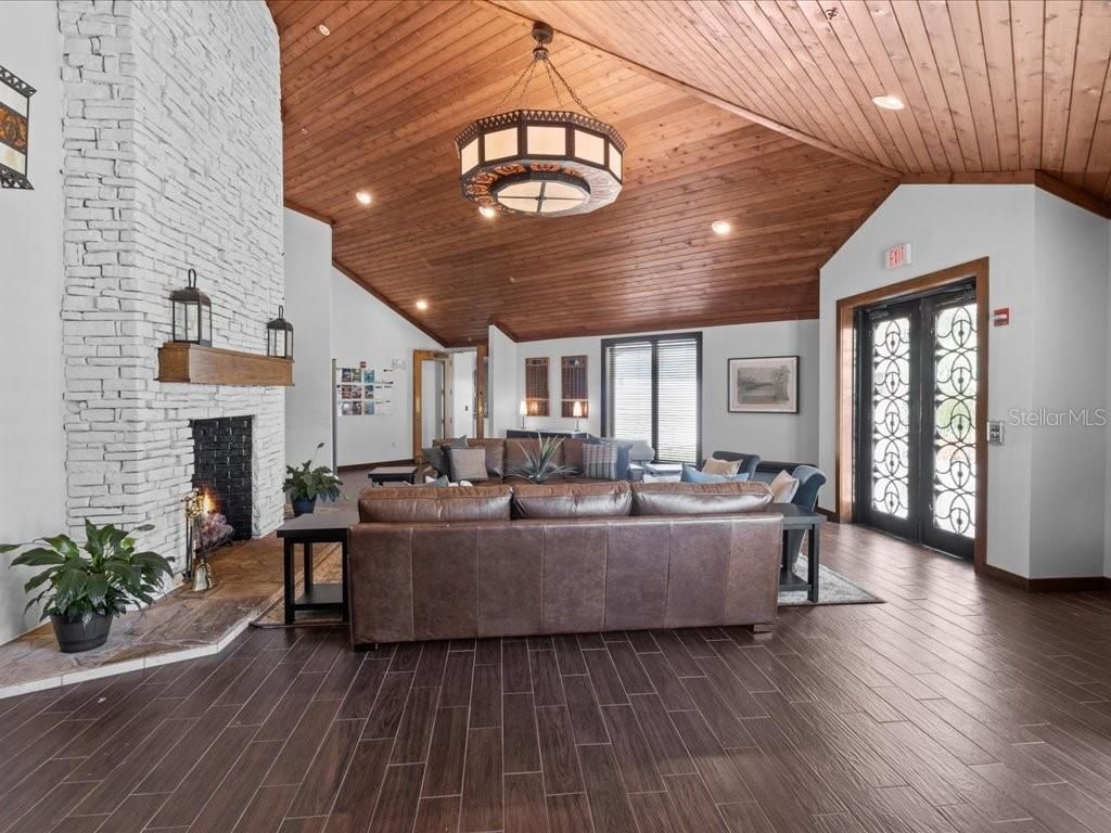Fireplace, Interior, Living room, Pendant Lights, Recessed Lighting, Stone Walls, Wooden Ceilings, Wood Texture Flooring