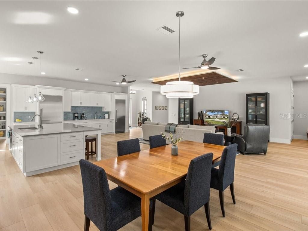 Dining room, Interior, Kitchen, Living room, Pendant Lights, Recessed Lighting, Stainless Steel Appliances, Wood Texture Flooring