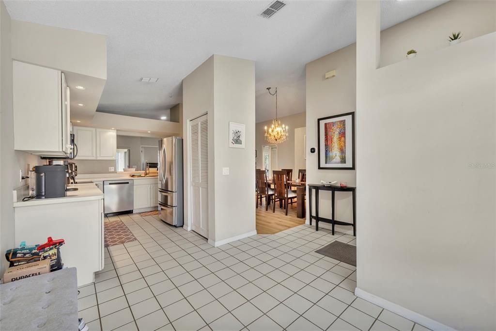 Chandelier, Dining room, Interior, Kitchen, Recessed Lighting, Stainless Steel Appliances, Wood Texture Flooring