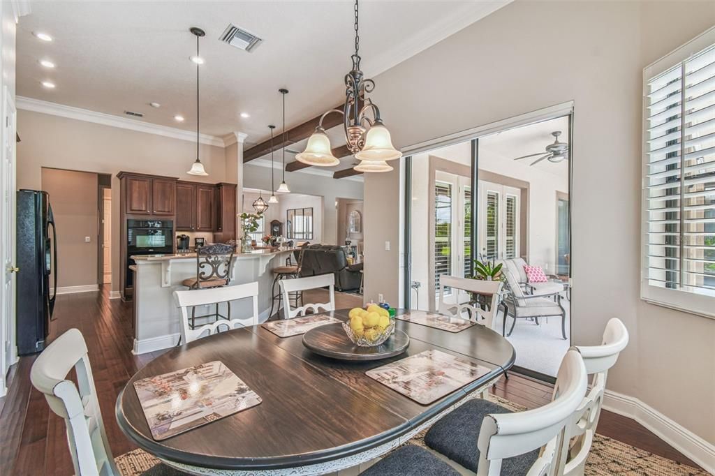 Dining room, Interior, Kitchen, Pendant Lights, Recessed Lighting, Stainless Steel Appliances, Wood Texture Flooring