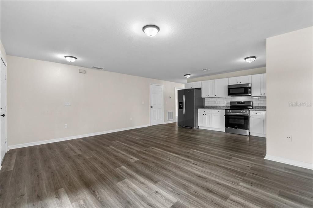 Empty room, Interior, Kitchen, Stainless Steel Appliances, Wood Texture Flooring