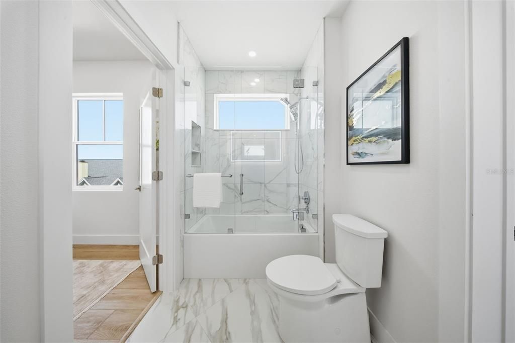 Bathroom, Glass Shower, Interior, Marble, Marble Walls, Recessed Lighting, Wood Texture Flooring