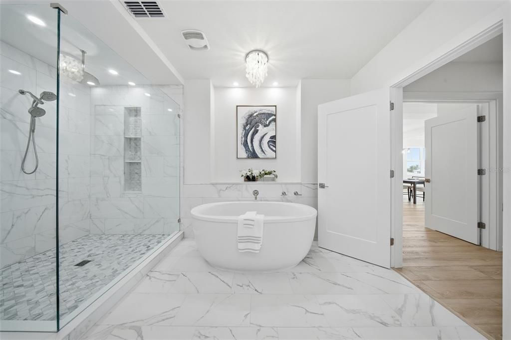 Bathroom, Chandelier, Free Standing Baths, Glass Shower, Interior, Marble, Marble Walls, Recessed Lighting