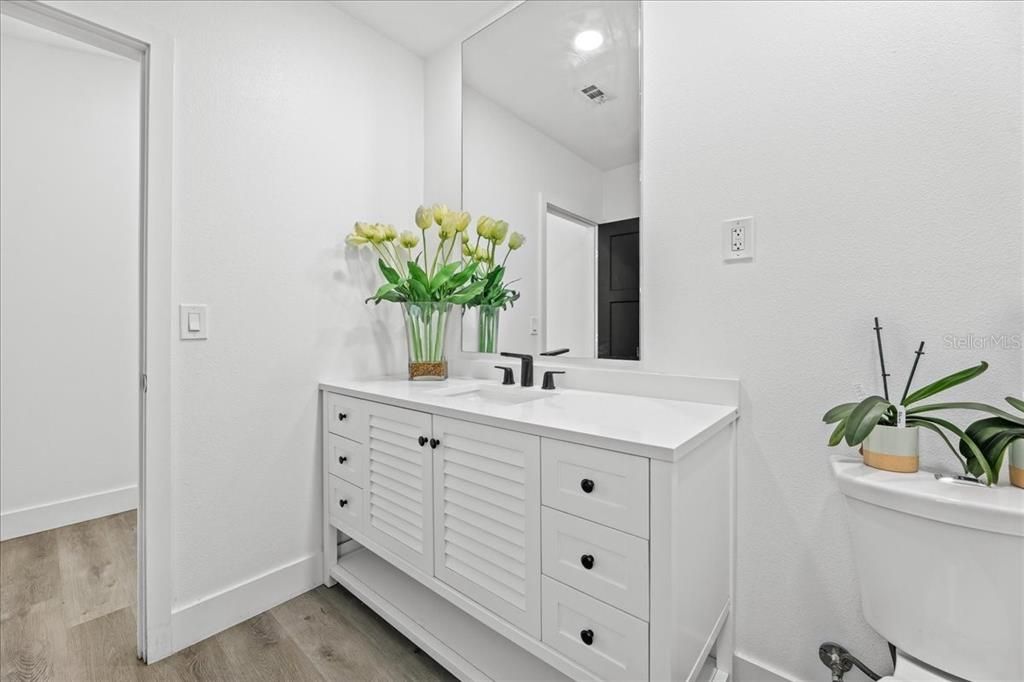 Bathroom, Dual Sink Vanities, Interior, Recessed Lighting, Wood Texture Flooring