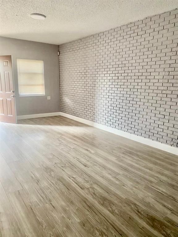 Empty room, Interior, Recessed Lighting, Stone Walls, Wood Texture Flooring