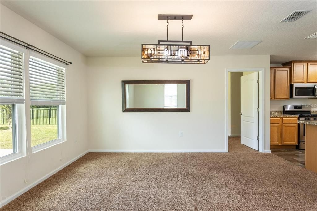 Chandelier, Empty room, Interior, Kitchen, Pendant Lights, Stainless Steel Appliances