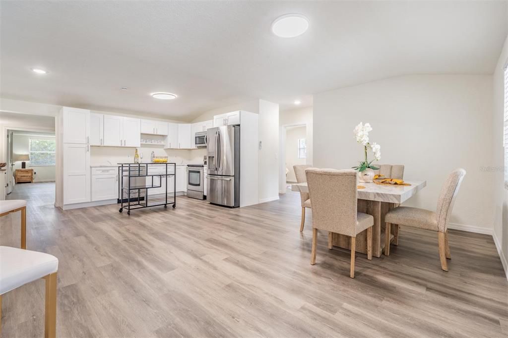 Dining room, Interior, Kitchen, Recessed Lighting, Stainless Steel Appliances, Wood Texture Flooring