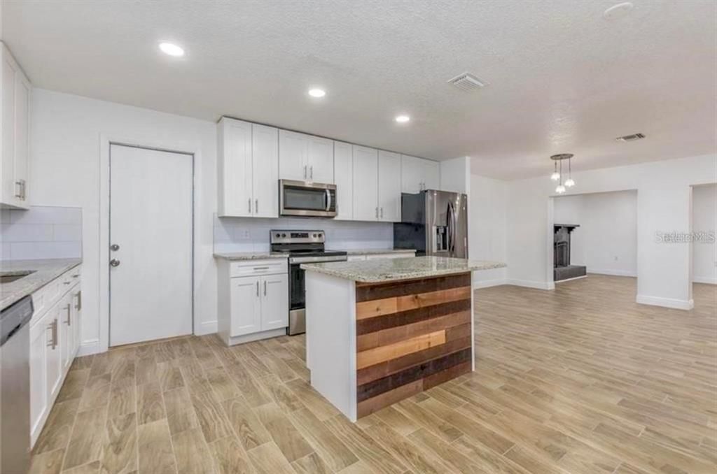 Interior, Kitchen, Pendant Lights, Recessed Lighting, Stainless Steel Appliances, Wood Texture Flooring