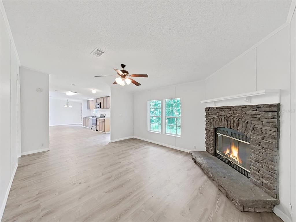 Empty room, Fireplace, Interior, Kitchen, Pendant Lights, Wood Texture Flooring