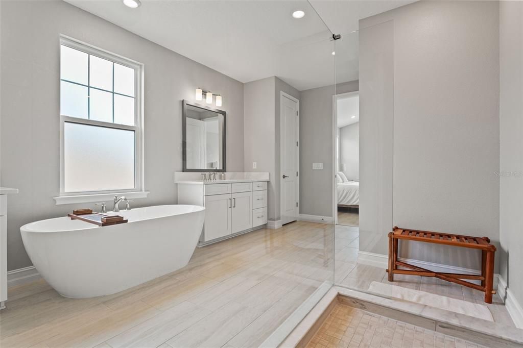 Bathroom, Free Standing Baths, Glass Shower, Interior, Recessed Lighting, Wood Texture Flooring