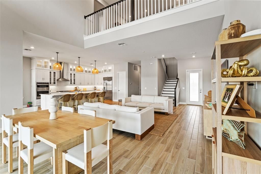 Dining room, Interior, Kitchen, Living room, Pendant Lights, Recessed Lighting, Stainless Steel Appliances, Wood Texture Flooring