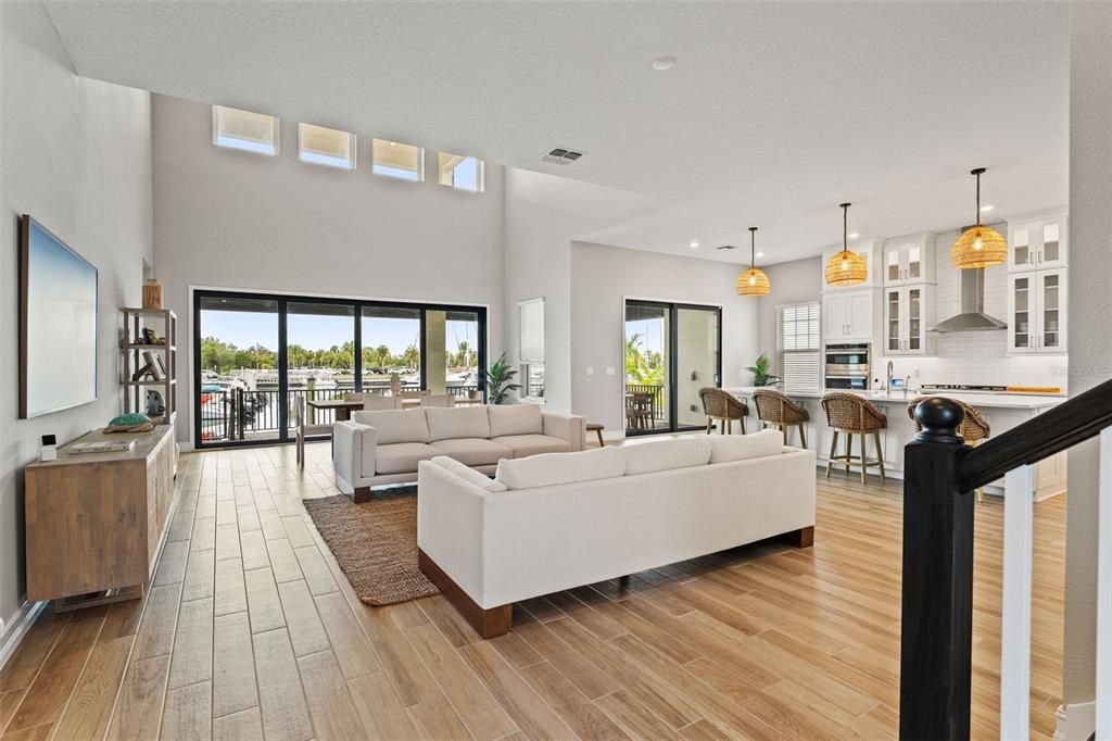 Dining room, Interior, Kitchen, Living room, Pendant Lights, Recessed Lighting, Stainless Steel Appliances, Wood Texture Flooring