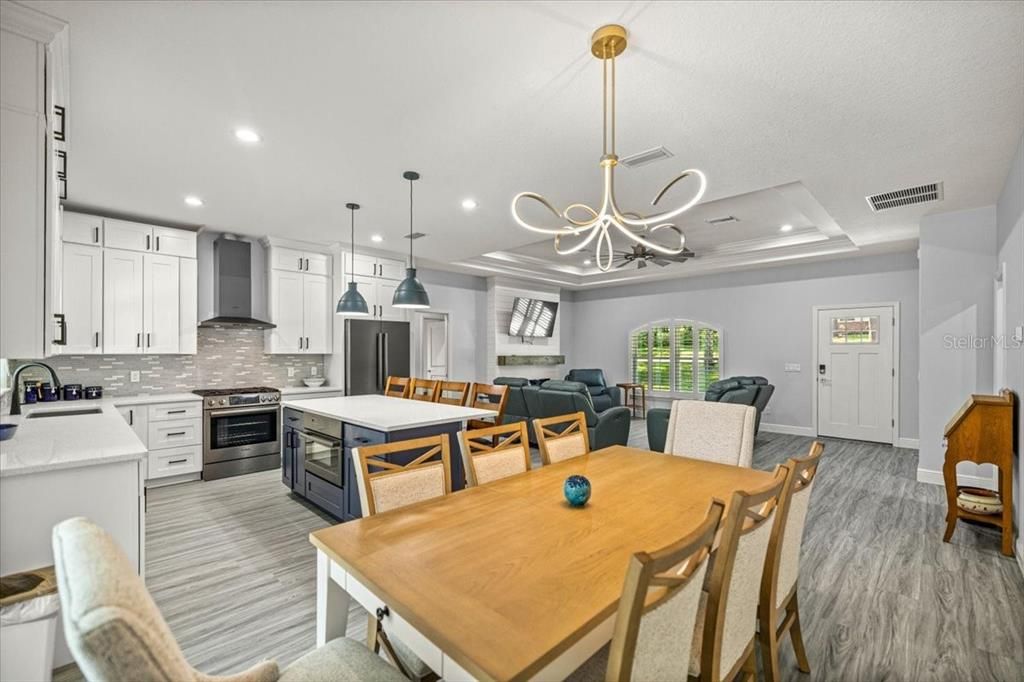Dining room, Interior, Kitchen, Pendant Lights, Recessed Lighting, Stainless Steel Appliances, Wood Texture Flooring