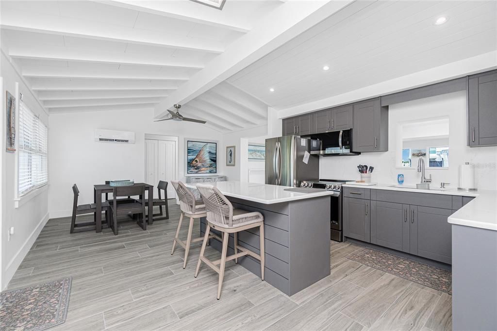 Dining room, Interior, Kitchen, Recessed Lighting, Stainless Steel Appliances, Wood Texture Flooring