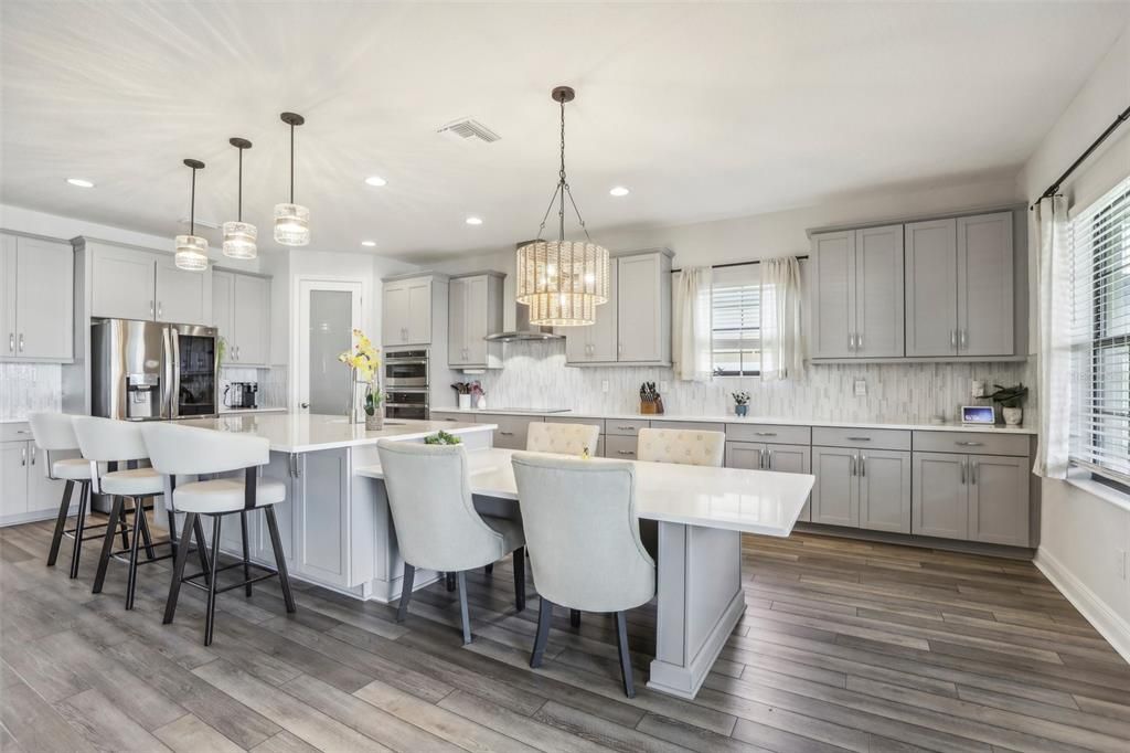 Chandelier, Interior, Kitchen, Pendant Lights, Recessed Lighting, Stainless Steel Appliances, Wood Texture Flooring