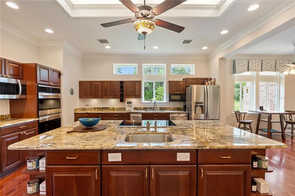 Dining room, Interior, Kitchen, Recessed Lighting, Stainless Steel Appliances, Wood Texture Flooring