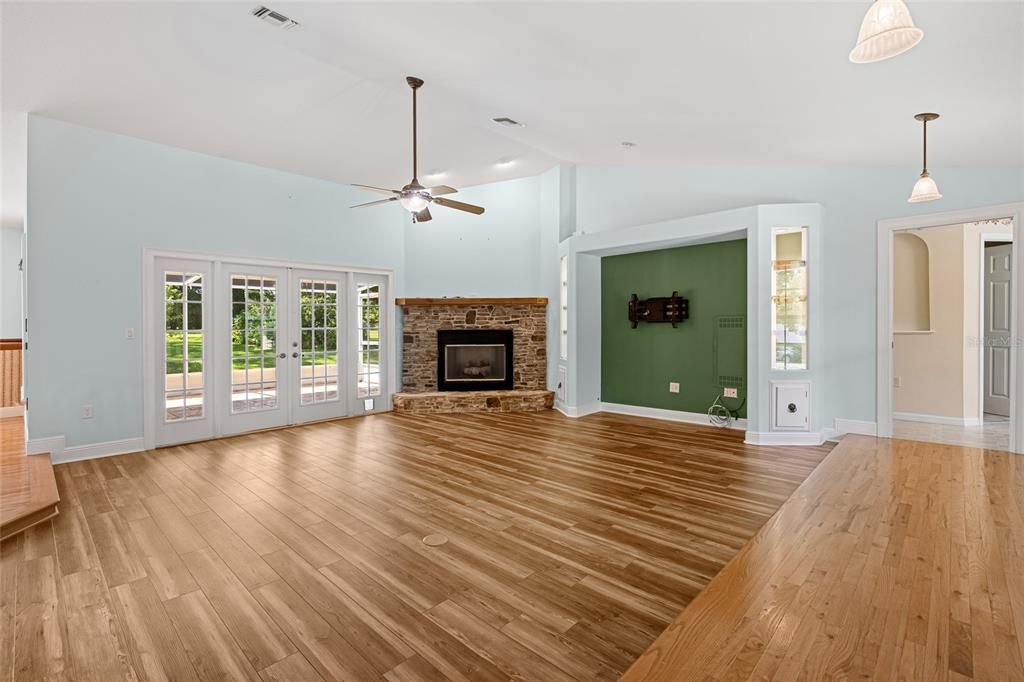 Empty room, Fireplace, Interior, Pendant Lights, Recessed Lighting, Wood Texture Flooring