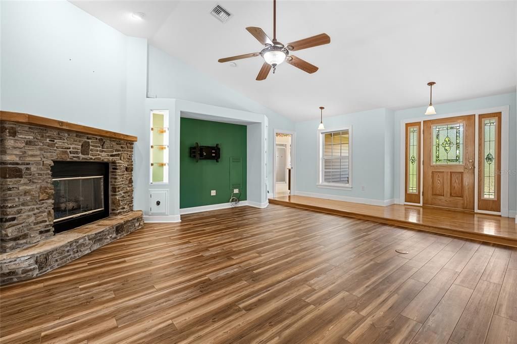 Empty room, Fireplace, Interior, Pendant Lights, Recessed Lighting, Wood Texture Flooring