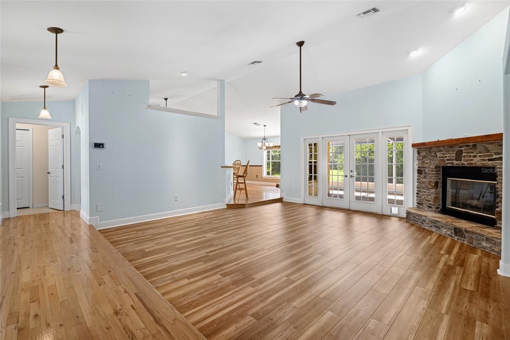 Chandelier, Empty room, Fireplace, Interior, Pendant Lights, Recessed Lighting, Wood Texture Flooring