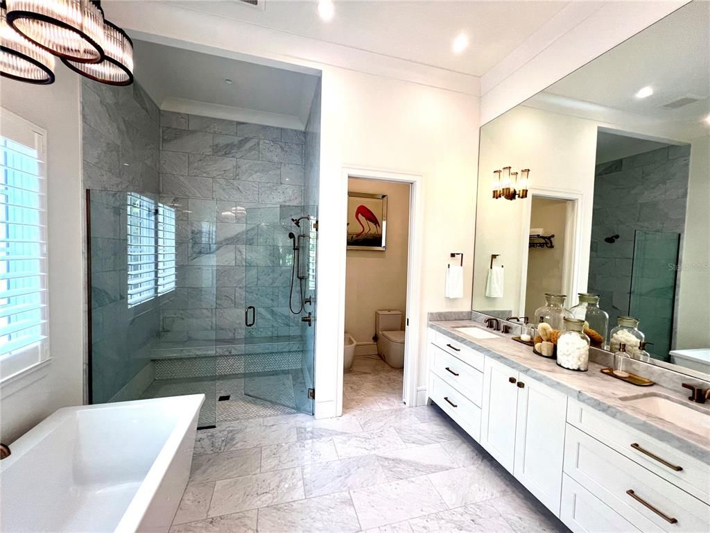 Bathroom, Dual Sink Vanities, Glass Shower, Interior, Marble, Marble Walls, Recessed Lighting