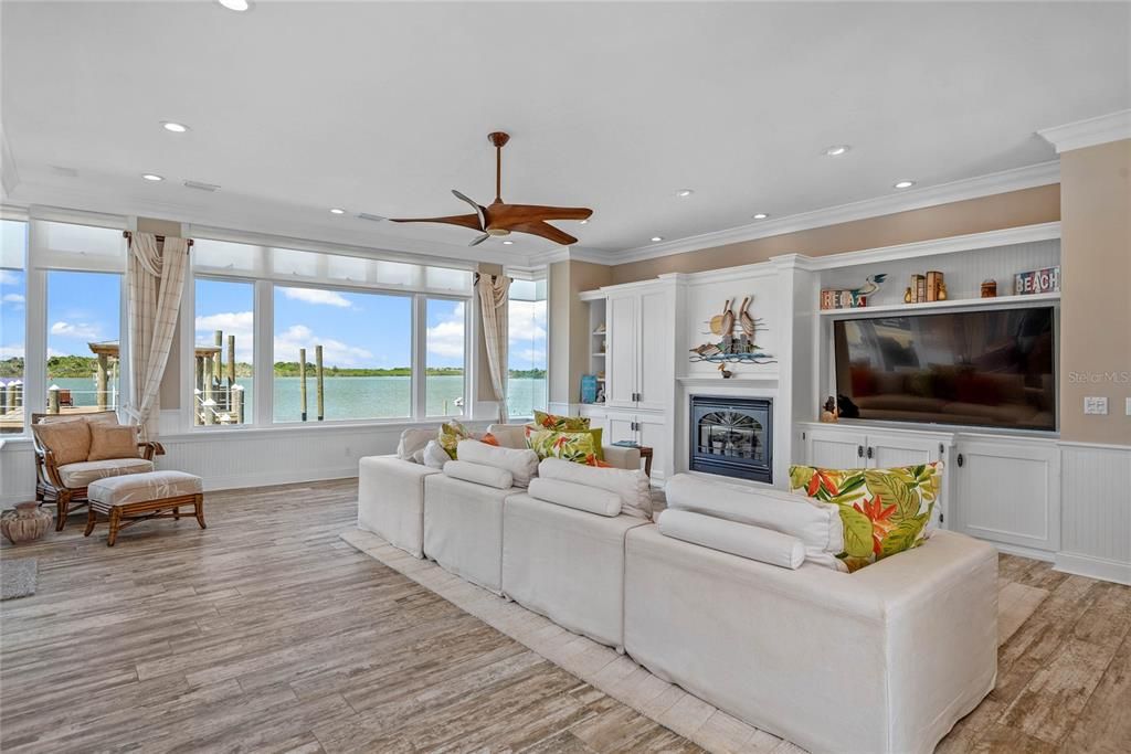 Fireplace, Interior, Living room, Recessed Lighting, Water, Wood Texture Flooring