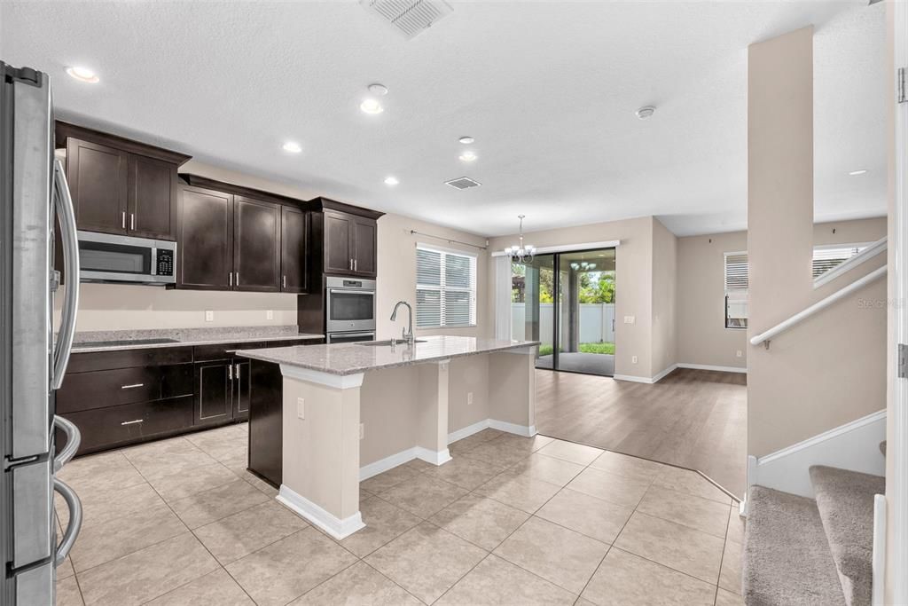 Chandelier, Interior, Kitchen, Recessed Lighting, Stainless Steel Appliances, Wood Texture Flooring