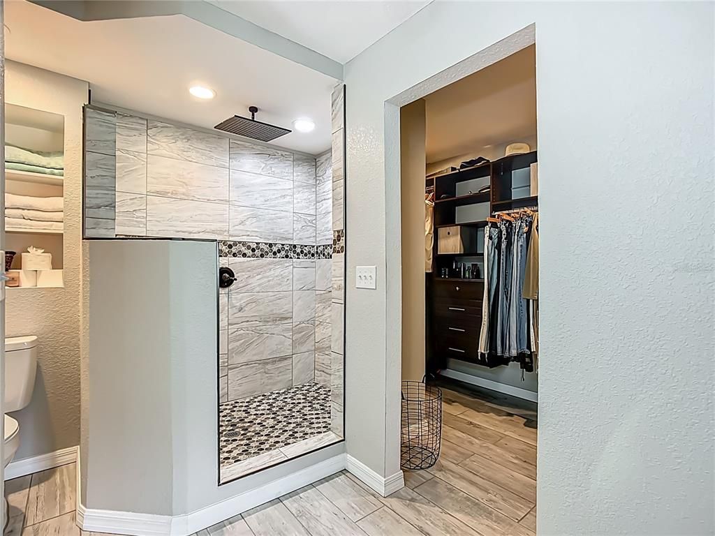 Bathroom, Glass Shower, Interior, Marble Walls, Recessed Lighting, Walk-in Closets, Wood Texture Flooring