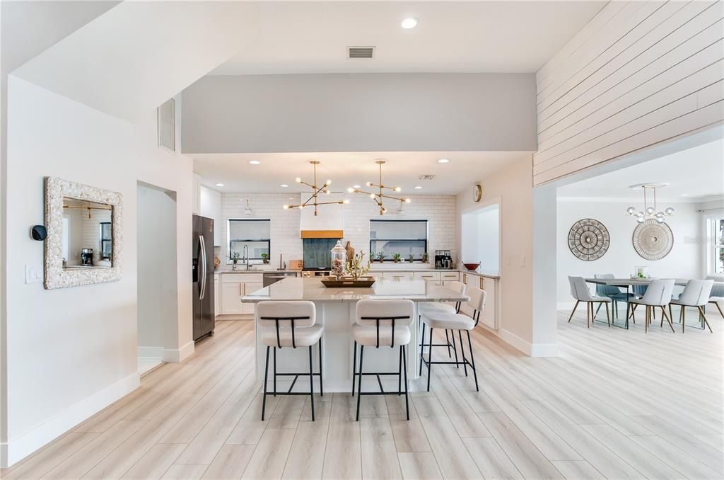 Dining room, Interior, Kitchen, Pendant Lights, Recessed Lighting, Stainless Steel Appliances, Stone Walls, Wood Texture Flooring