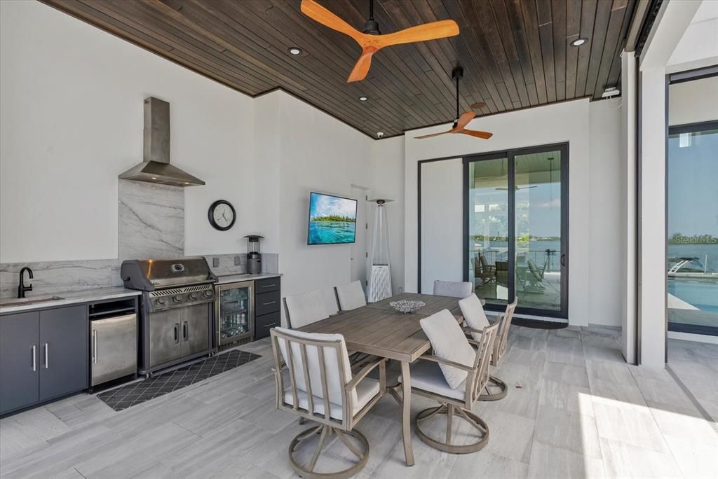 Dining room, Interior, Kitchen, Recessed Lighting, Stainless Steel Appliances, Water, Wooden Ceilings, Wood Texture Flooring