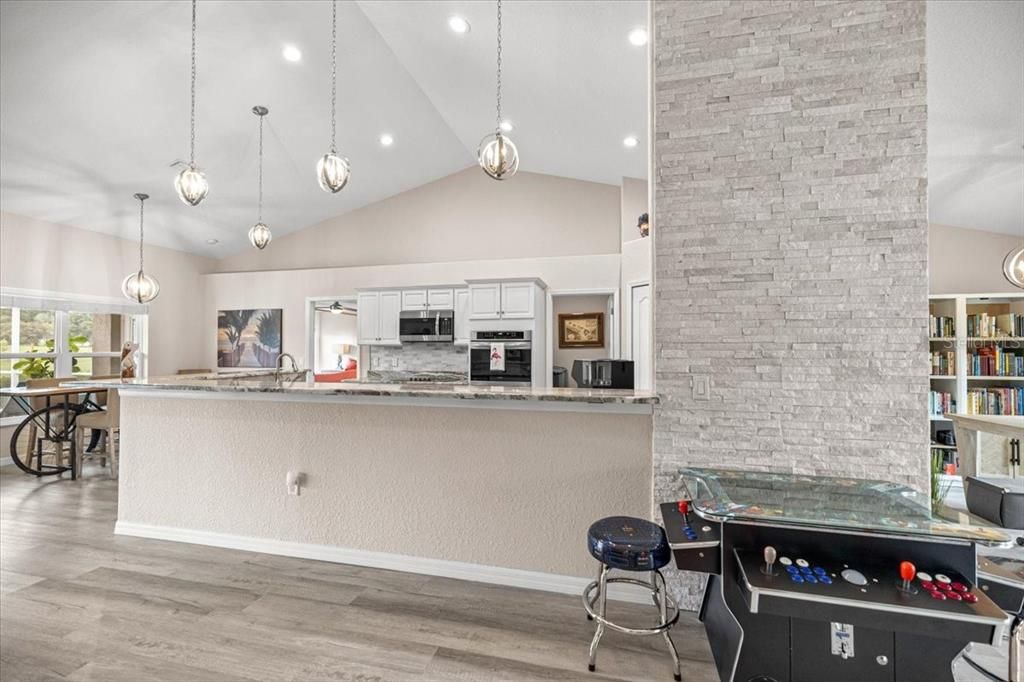 Interior, Kitchen, Pendant Lights, Recessed Lighting, Stainless Steel Appliances, Stone Walls, Wood Texture Flooring