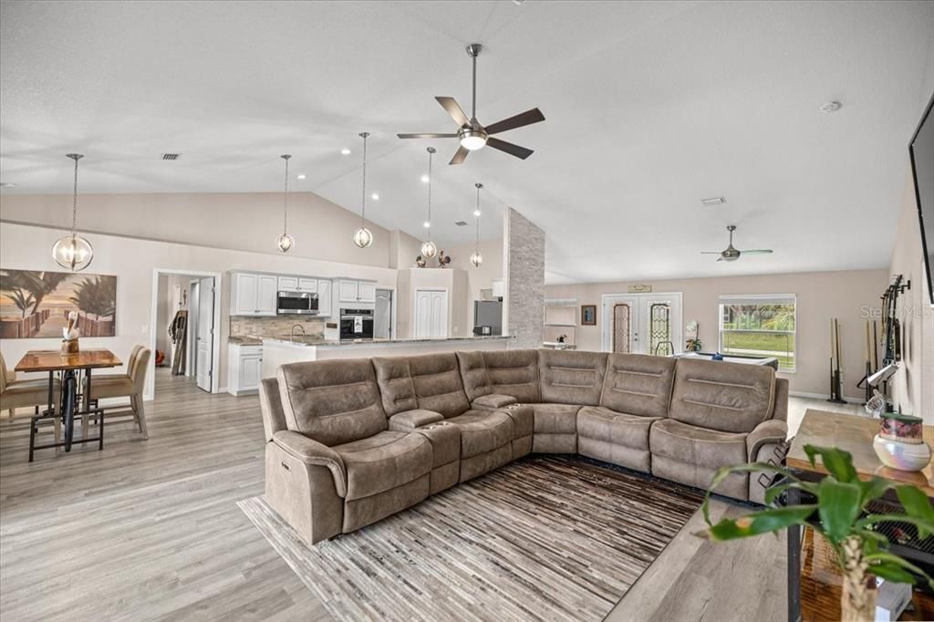 Dining room, Interior, Kitchen, Living room, Pendant Lights, Recessed Lighting, Stainless Steel Appliances, Wood Texture Flooring