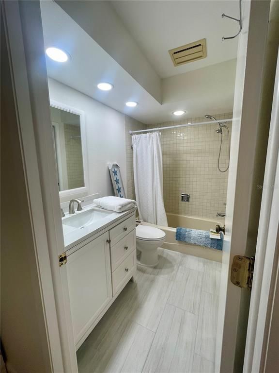Bathroom, Dual Sink Vanities, Interior, Recessed Lighting, Wood Texture Flooring