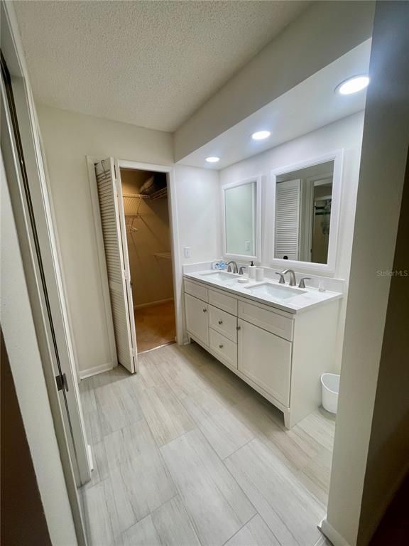 Bathroom, Dual Sink Vanities, Interior, Recessed Lighting, Wood Texture Flooring