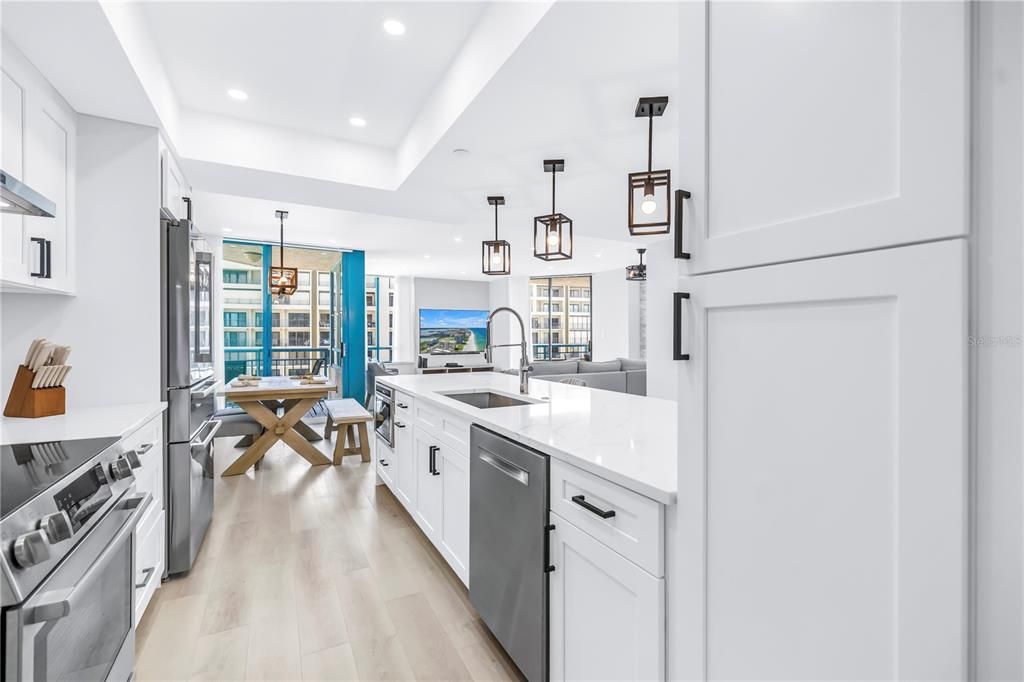 Dining room, Interior, Kitchen, Pendant Lights, Recessed Lighting, Stainless Steel Appliances, Water, Wood Texture Flooring