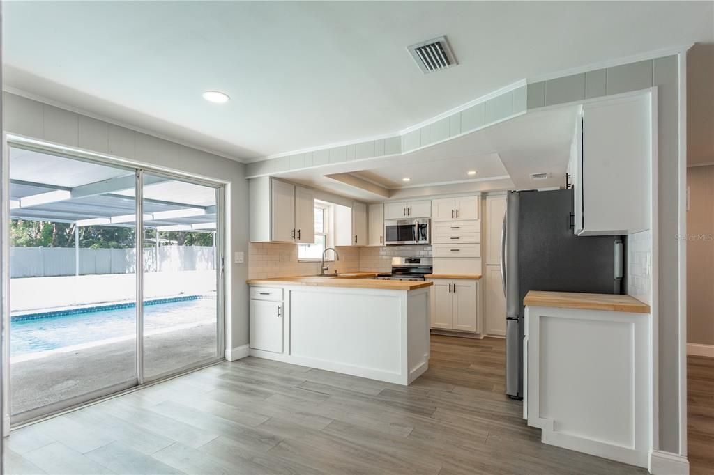 Interior, Kitchen, Recessed Lighting, Stainless Steel Appliances, Wood Texture Flooring