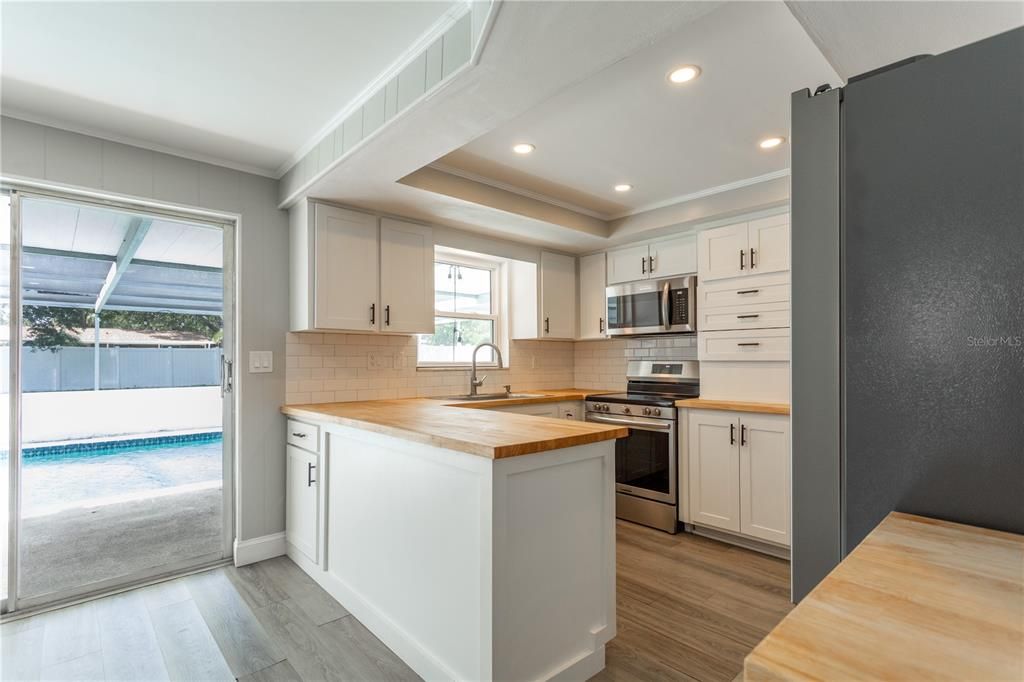 Interior, Kitchen, Recessed Lighting, Stainless Steel Appliances, Wood Texture Flooring