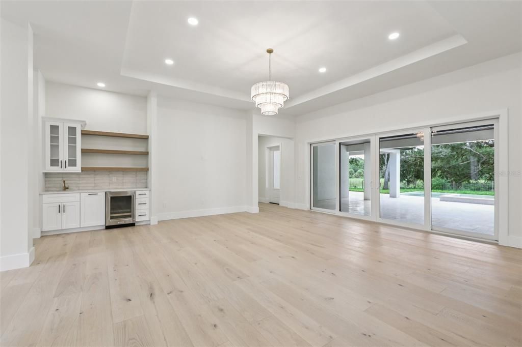 Chandelier, Empty room, Fireplace, Interior, Recessed Lighting, Wood Texture Flooring