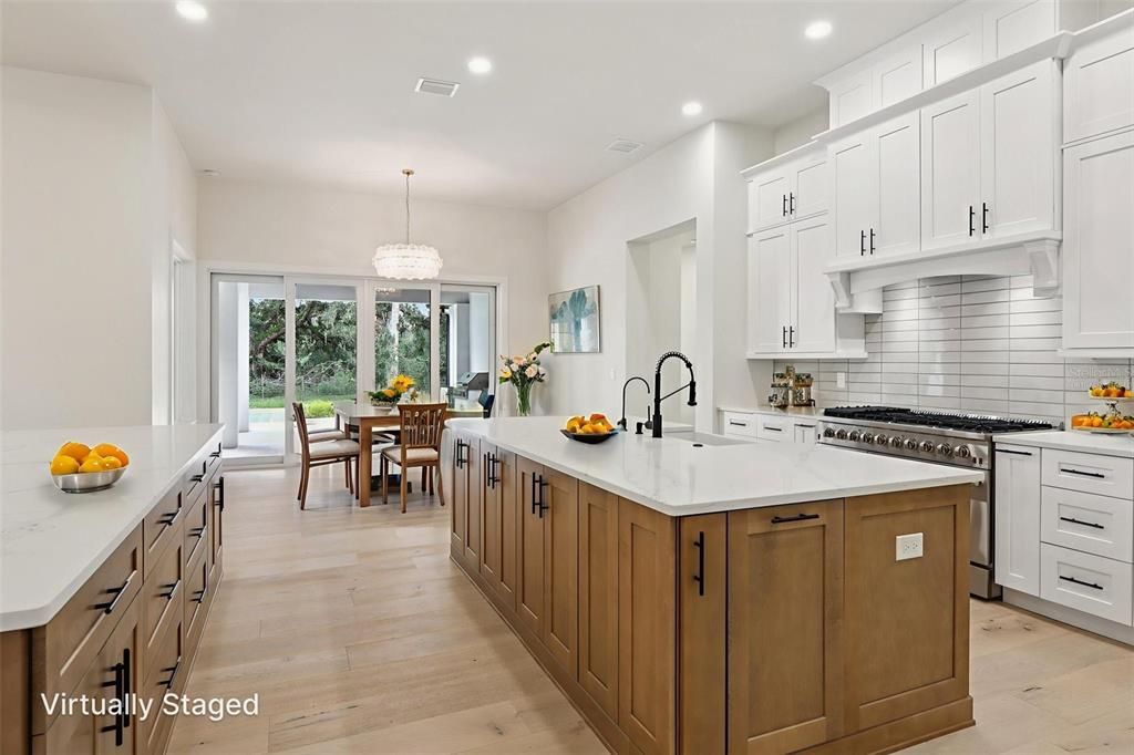 Chandelier, Dining room, Interior, Kitchen, Pendant Lights, Recessed Lighting, Stainless Steel Appliances, Wood Texture Flooring