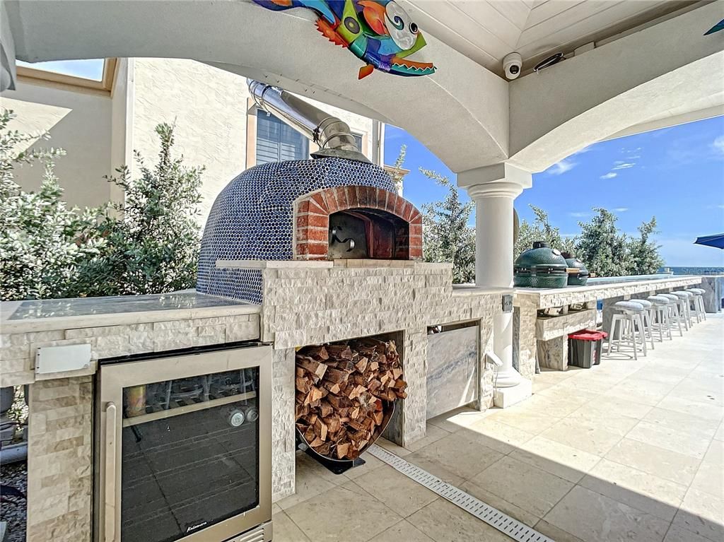 Exterior, Fireplace, Outdoor Kitchen, Water
