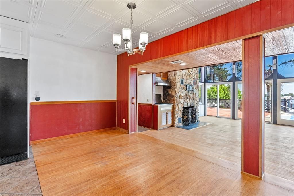 Chandelier, Empty room, Fireplace, Interior, Stone Walls, Wood Texture Flooring