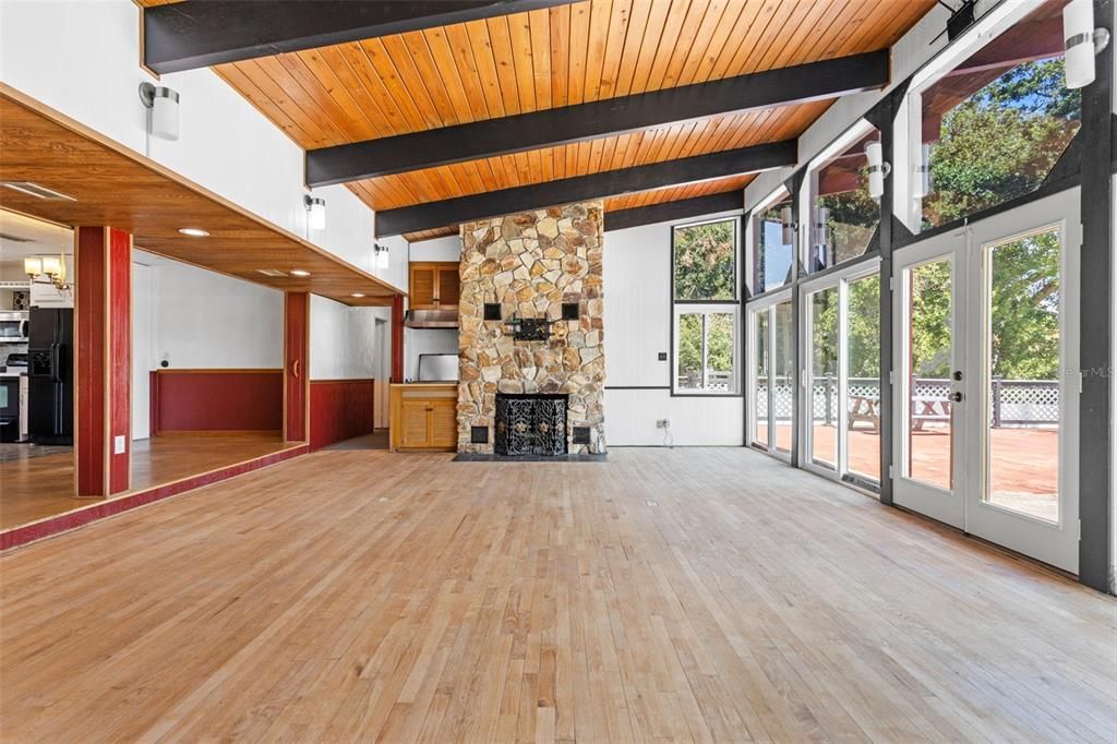Empty room, Fireplace, Interior, Recessed Lighting, Stone Walls, Wooden Beams, Wooden Ceilings, Wood Texture Flooring