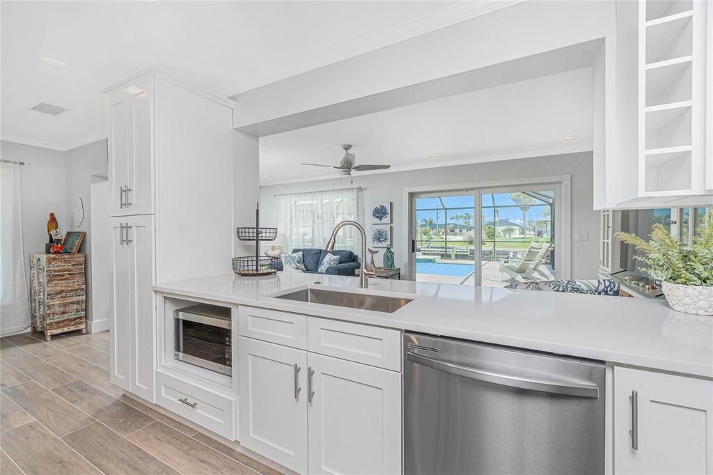 Interior, Kitchen, Recessed Lighting, Stainless Steel Appliances, Water, Wood Texture Flooring