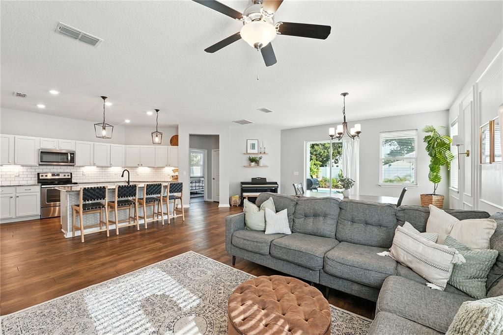 Dining room, Interior, Kitchen, Living room, Pendant Lights, Recessed Lighting, Stainless Steel Appliances, Wood Texture Flooring