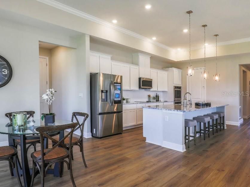 Dining room, Interior, Kitchen, Pendant Lights, Recessed Lighting, Stainless Steel Appliances, Wood Texture Flooring