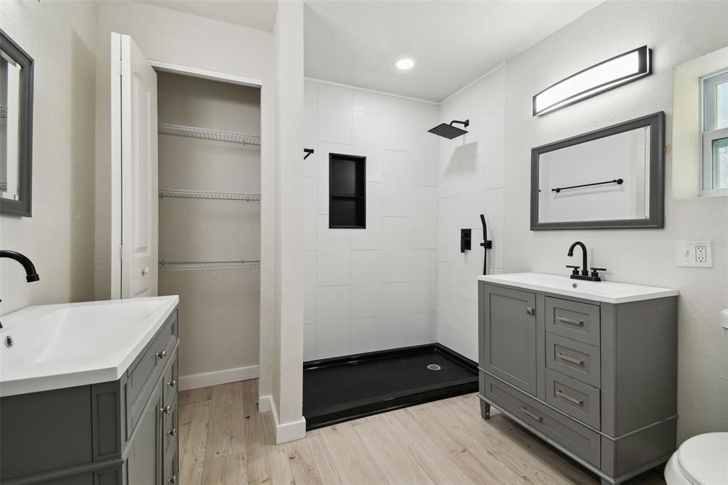 Bathroom, Dual Sink Vanities, Glass Shower, Interior, Recessed Lighting, Wood Texture Flooring