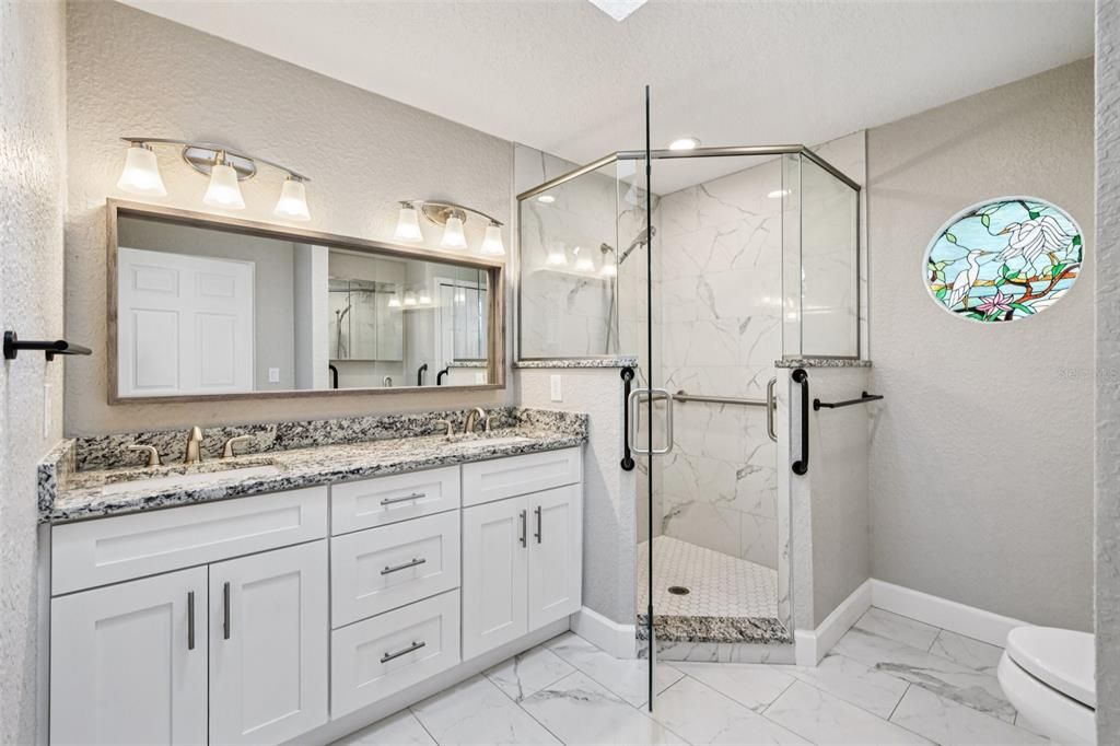 Bathroom, Dual Sink Vanities, Glass Shower, Interior, Marble, Marble Walls, Recessed Lighting
