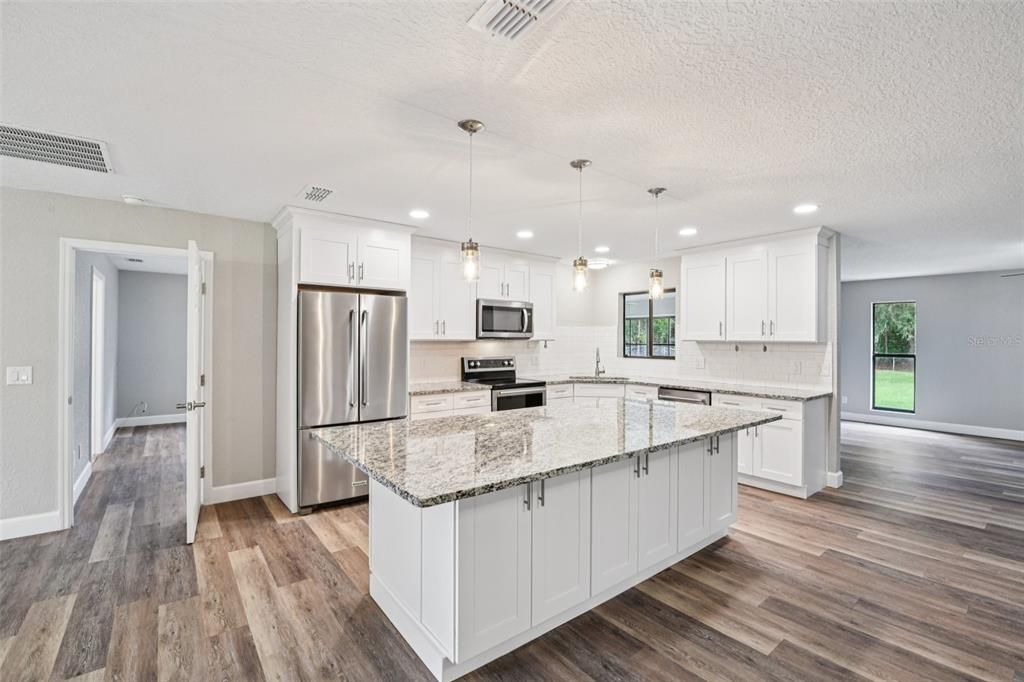 Interior, Kitchen, Pendant Lights, Recessed Lighting, Stainless Steel Appliances, Wood Texture Flooring