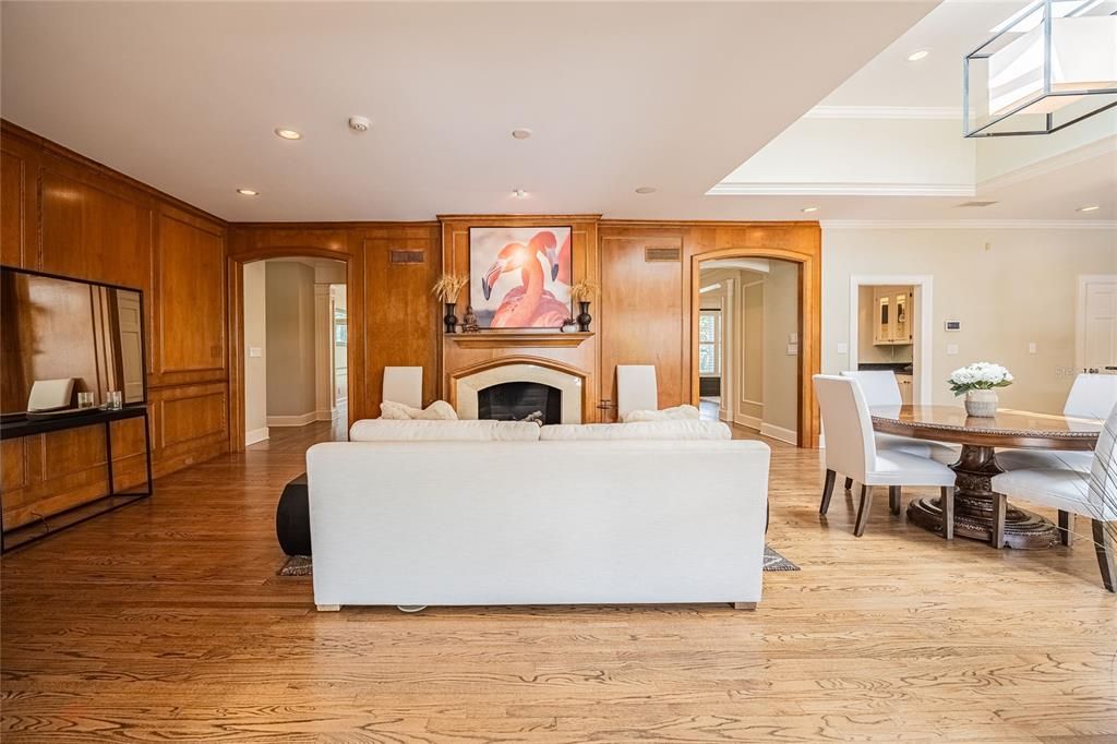 Dining room, Fireplace, Interior, Living room, Recessed Lighting, Wood Texture Flooring, Wooden Walls
