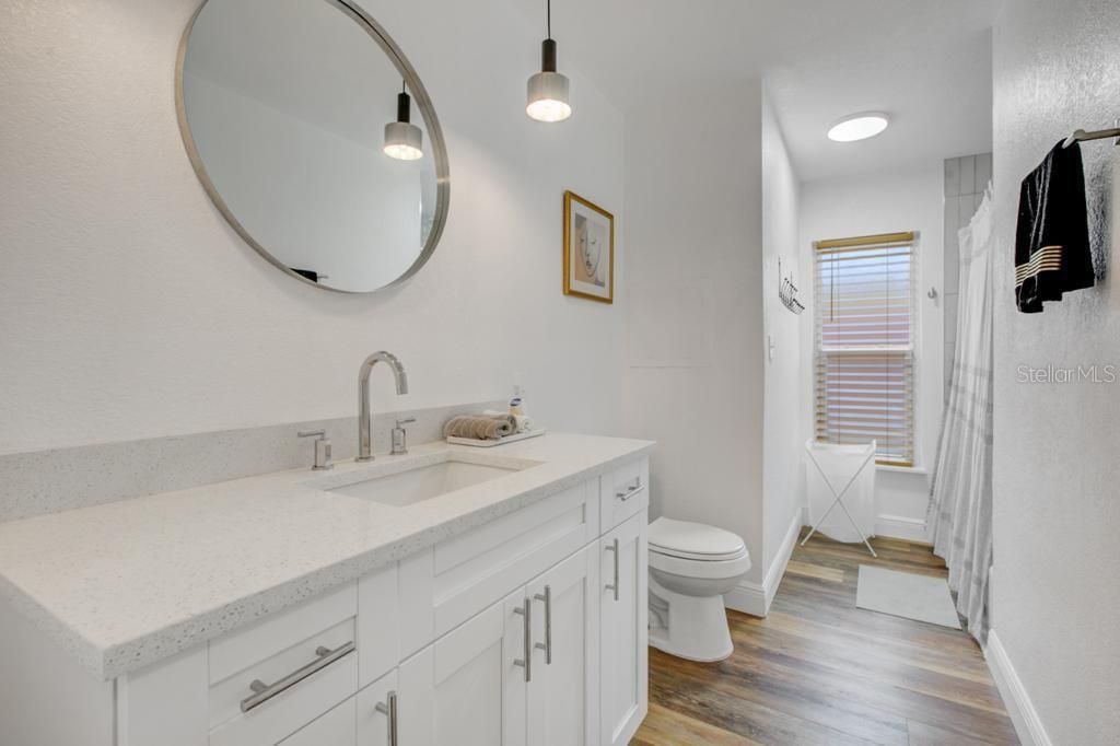 Bathroom, Dual Sink Vanities, Interior, Pendant Lights, Wood Texture Flooring