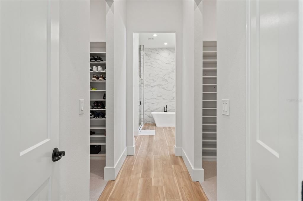 Bathroom, Free Standing Baths, Interior, Marble Walls, Recessed Lighting, Walk-in Closets, Wood Texture Flooring